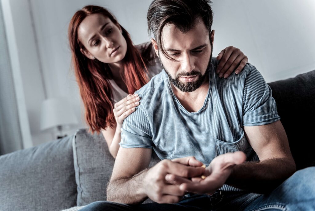 Ma suffering from depression being supported by his wife.